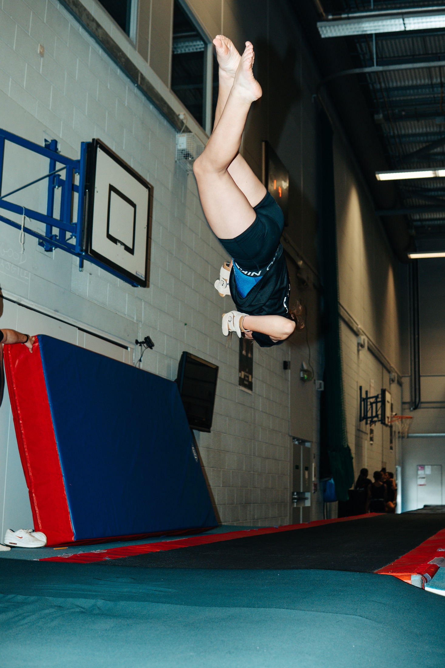 Coach and participant during Camp Aspire gymnastics training